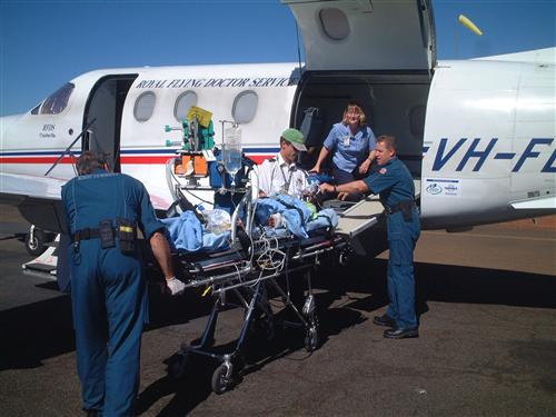 patient being loaded into RFDS aircraft